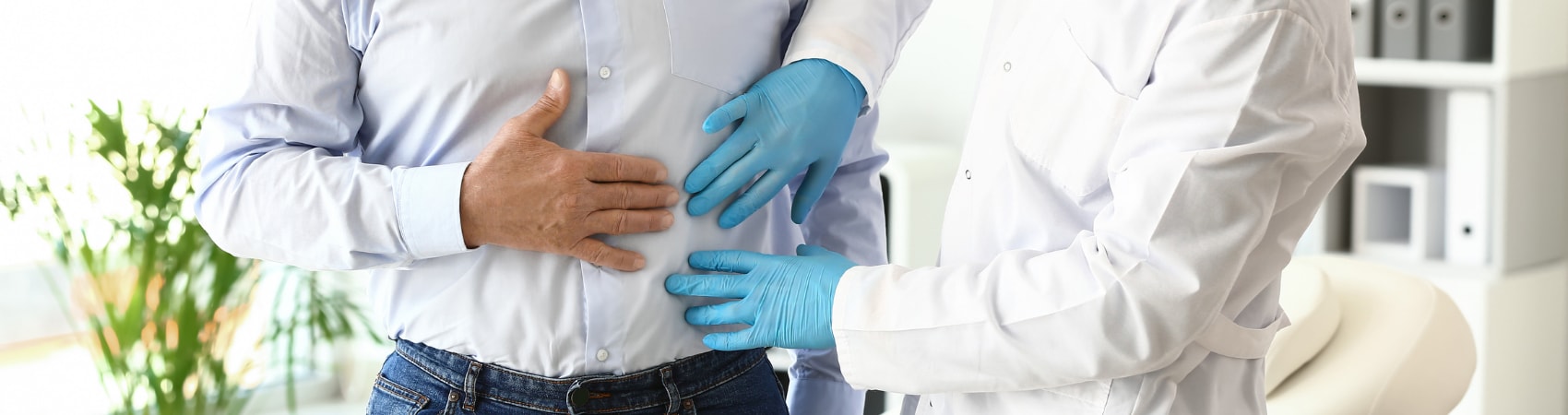 kidney doctor examining patient's stomach