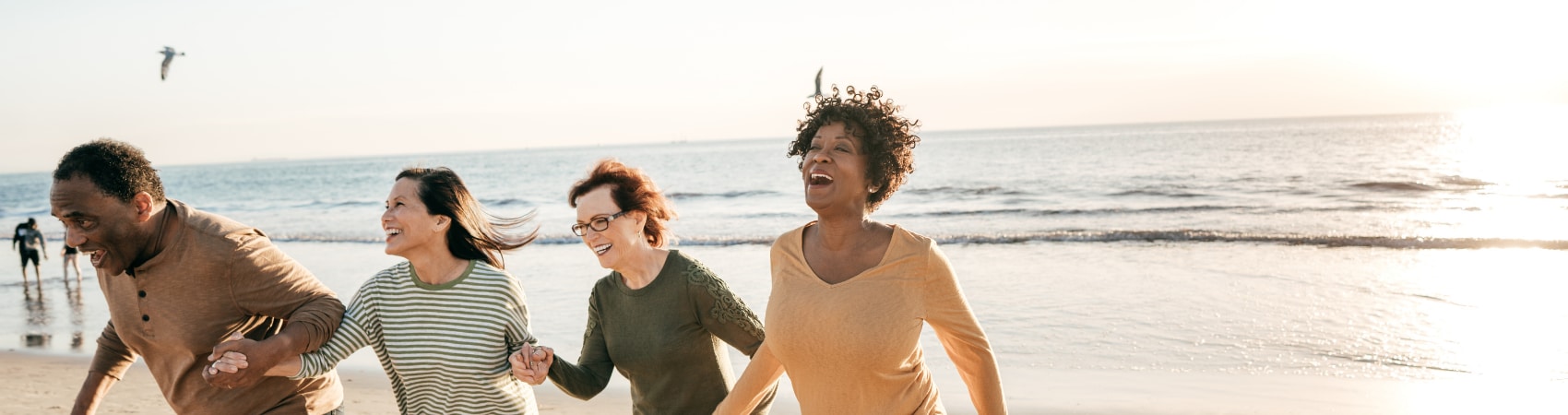 senior friends at the beach